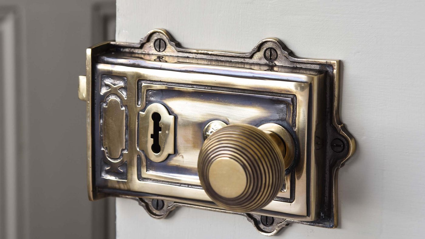 Brass Rim Lock with beehive door knobs fitted onto Victorian Door