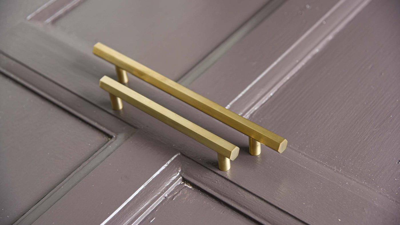 Satin Brass cabinet pull handles on antique panelling