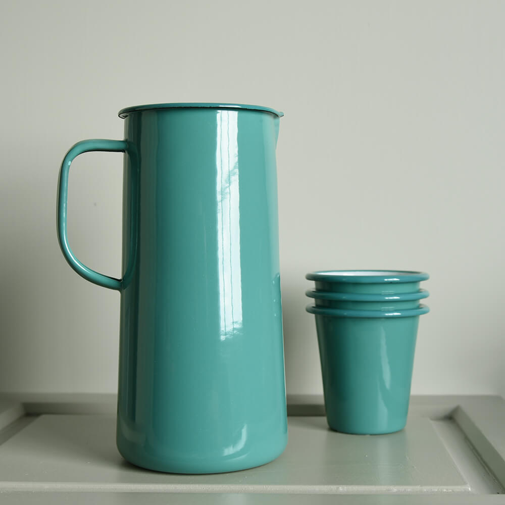 Jade green enamel jug with a little stack of matching tumblers