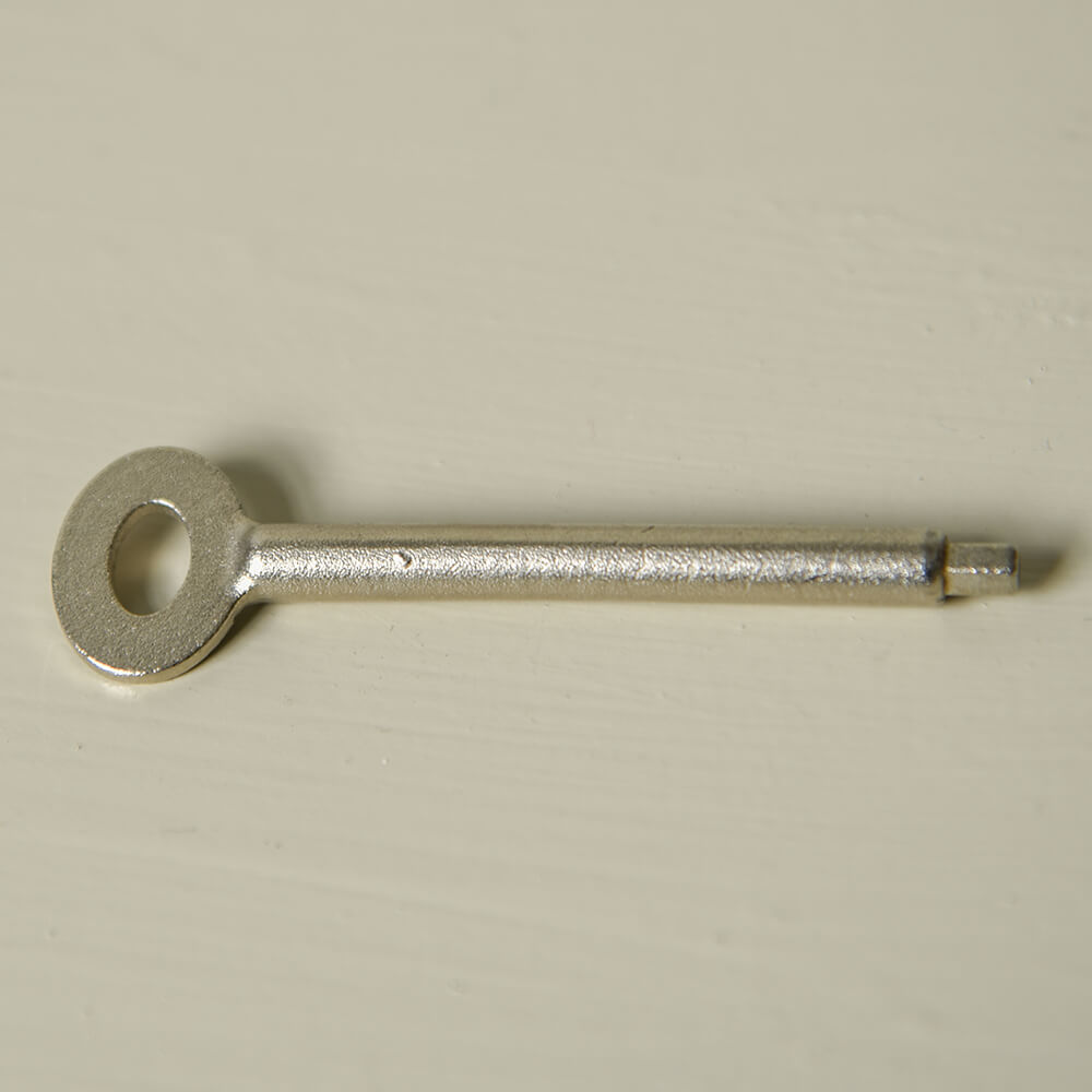 Key for Concave Sash Window Stop on a cream background