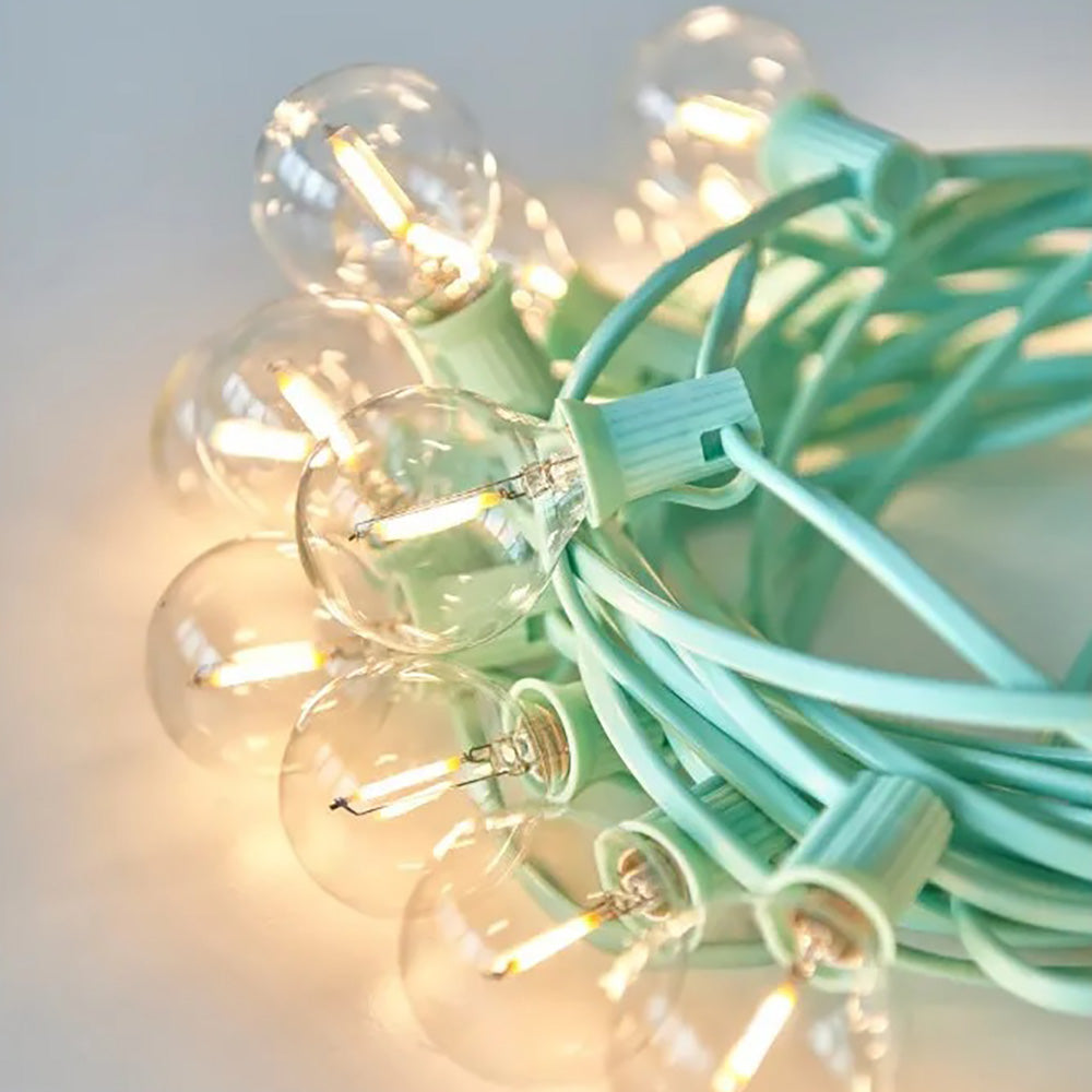 Set of festoon light with a light green cable wrapped up together in a circle