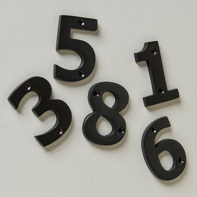 Aged bronze numerals for front door selection