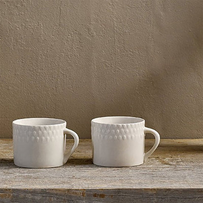 Pair of small embossed Ela mugs