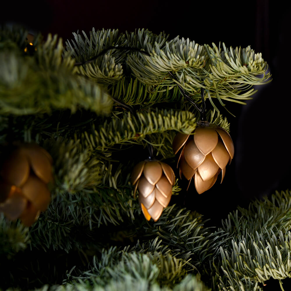 Gold PInecone LED fairy lights in a christmas tree