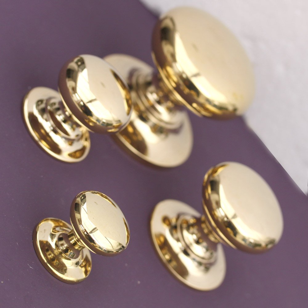 Four sizes of brass cabinet knobs