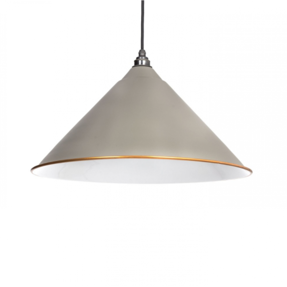A pendant light hung showing the warm grey exterior, white interior and copper rim