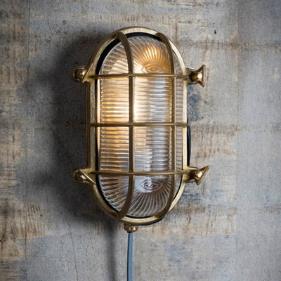Brass bulk head light with cage detail