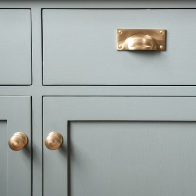Cupboard featuring Satin Brass Hooded Drawer Pull and Cabinet Knobs,