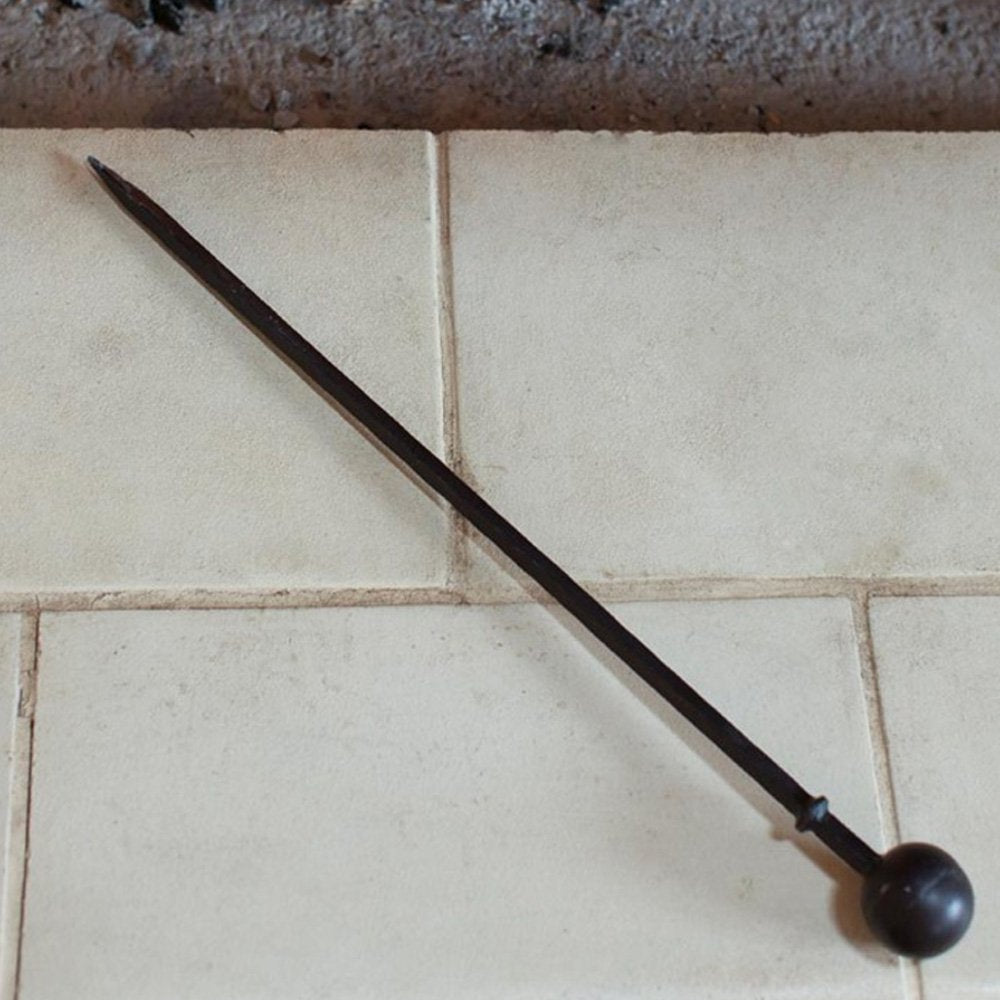 Large black iron fire poker with round ball on end of handle