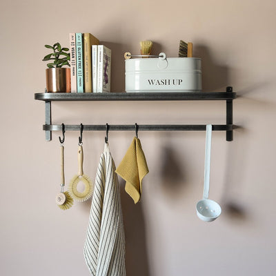 Steel shelf and hook rail with items displayed