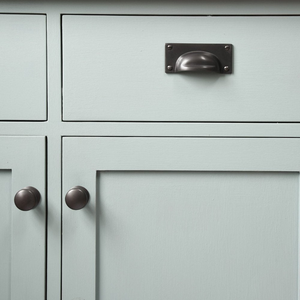 Matte Black Hooded Drawer Pull and Cabinet Knobs on Blue Cabinet