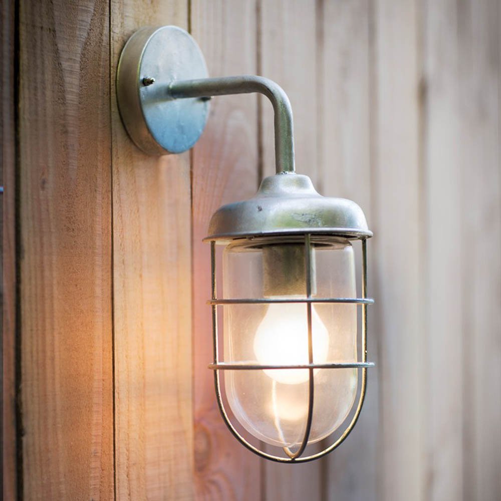 Industrial/maritime feel galvanised steel wall light with cage around glass shade