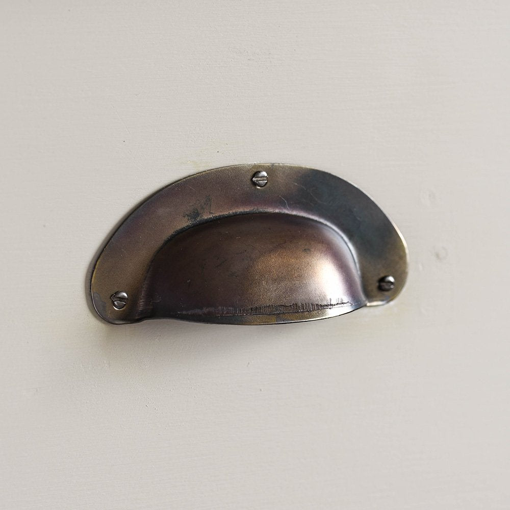 Pressed Brass Drawer Cup Handle in Aged Finish Variant