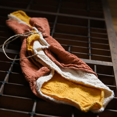 Bundle of 3 cotton cleaning cloths in three colours - brick red, mustard yellow and natural