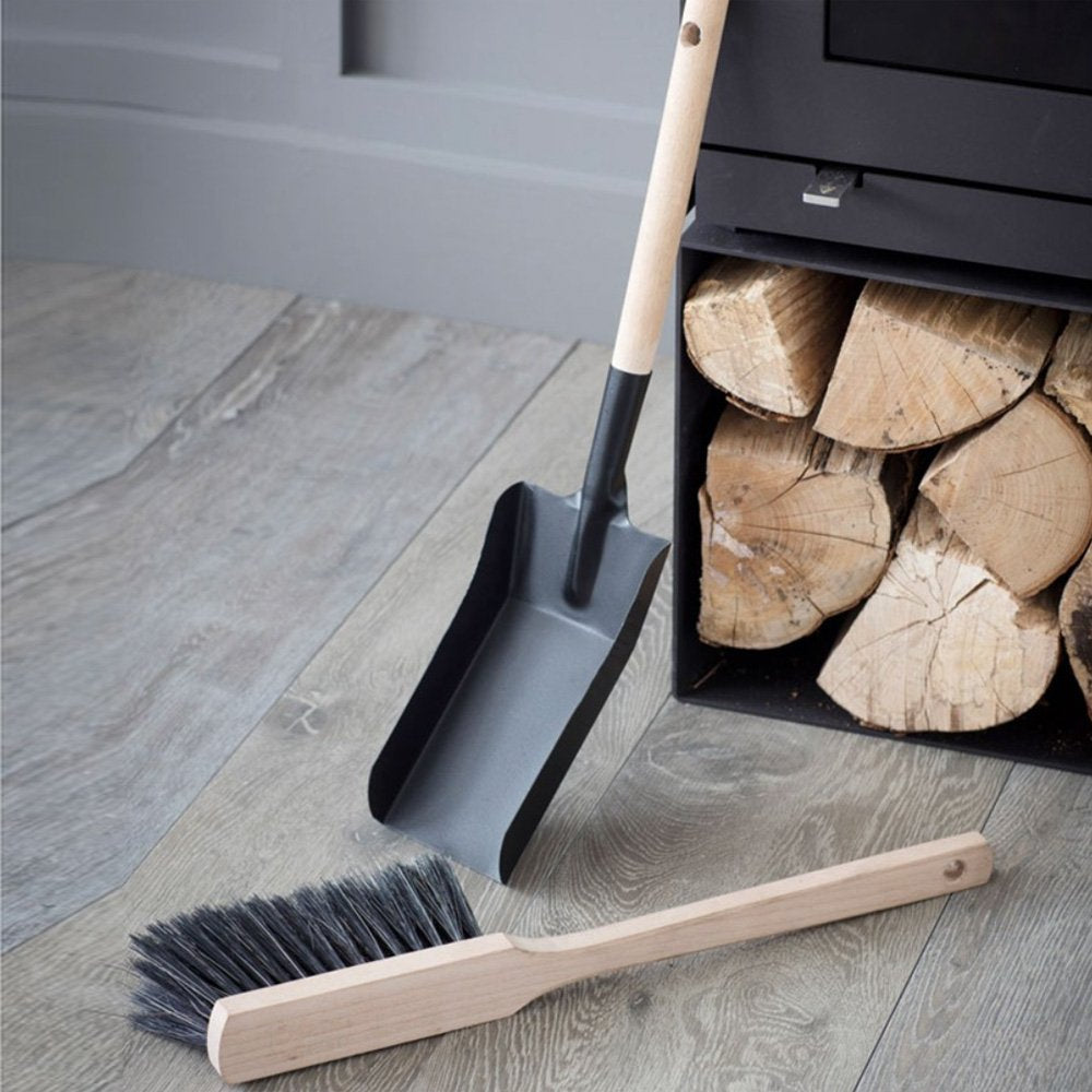 Slender dustpan and brush made from wood and steel with black nylon bristles