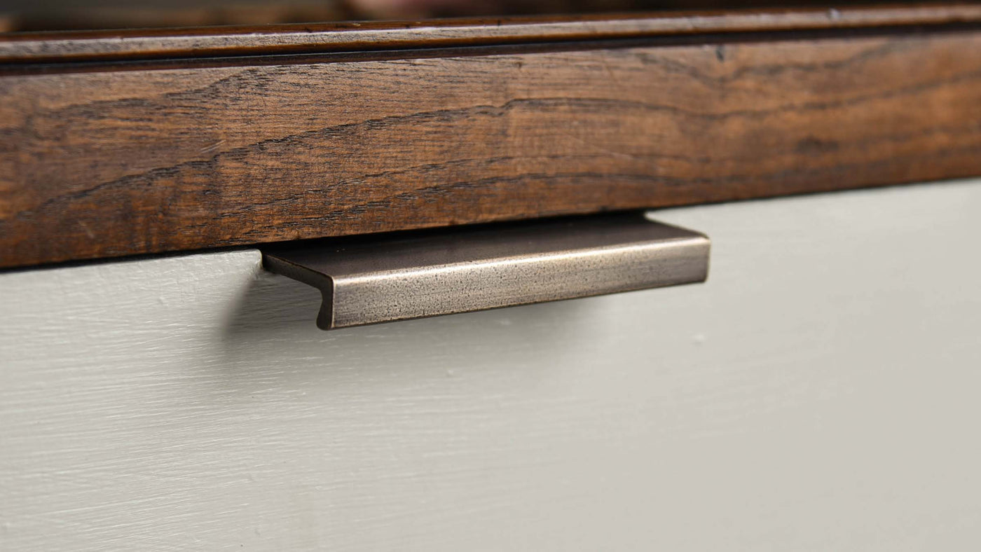 Brass Edge Pull on Kitchen Cabinet in distressed antique brass