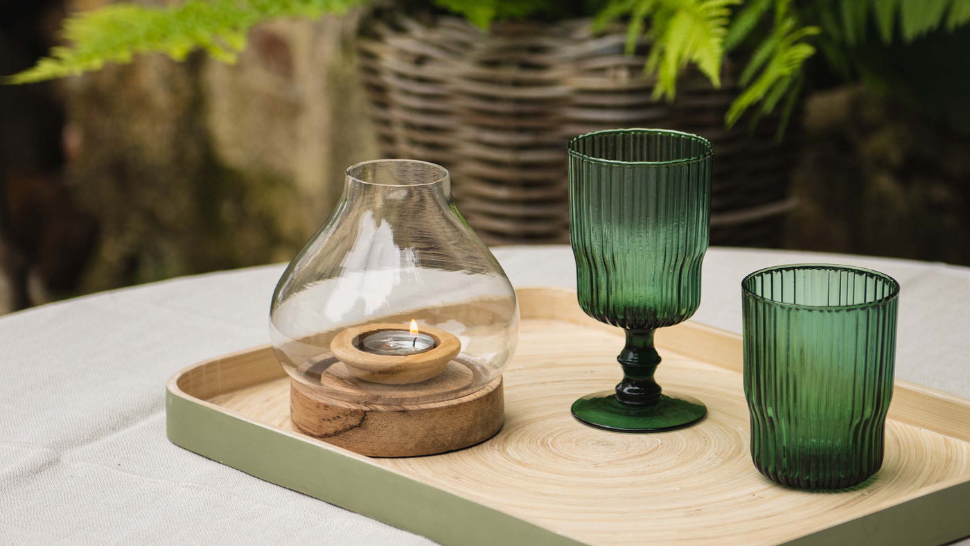 Candle Lantern on Wooden Base used on an outdoor dining table.