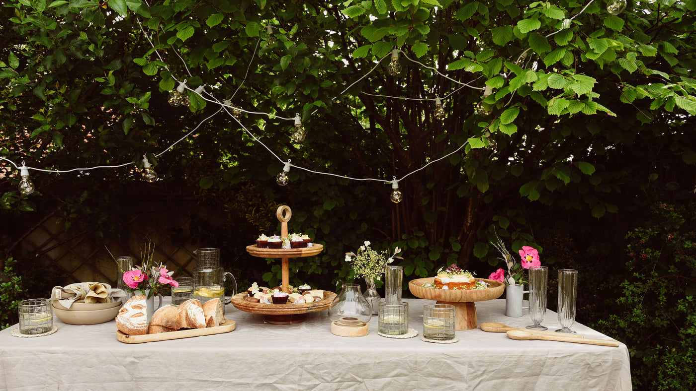 Festoon lights and party table outdoors