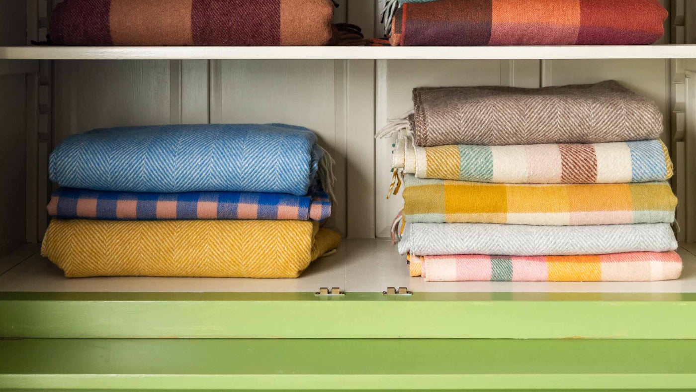Pile of Wool Blankets in a linen cupboard
