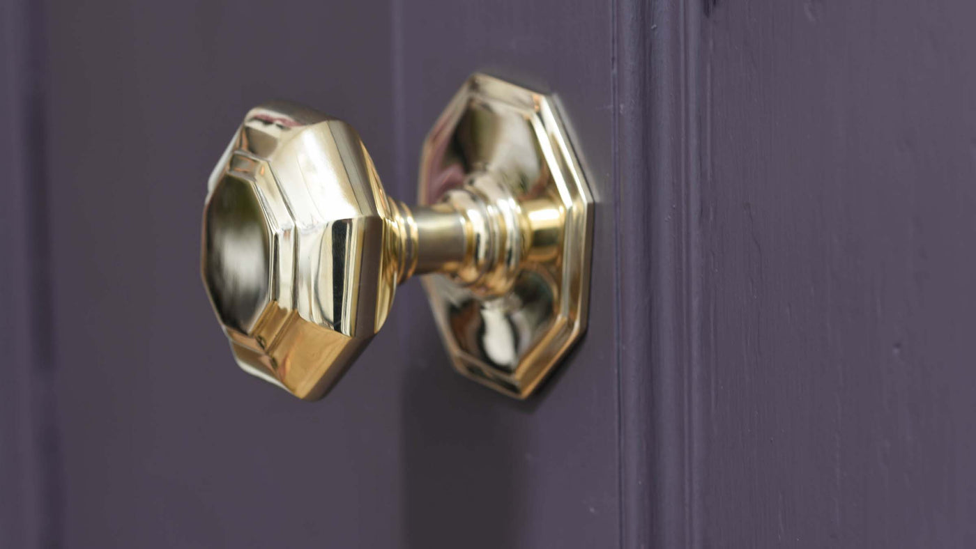 Traditional Victorian style door pull in solid polished antiqued brass