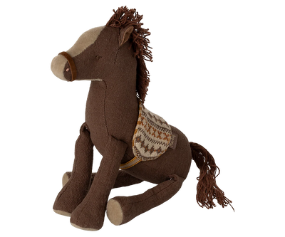 Brown plush horse toy with a saddle on a white background