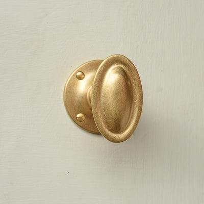 brass oval shaped door knob