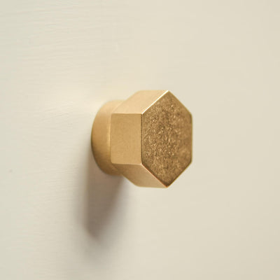 Aged Brass Hex Cabinet Knob shown in profile with a hexagonal form