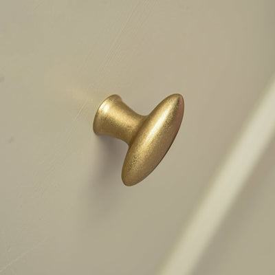 Zepplin shaped elongated oval aged brass cupboard knob2