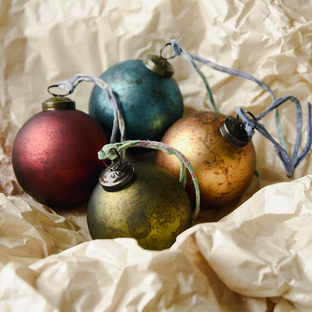 coloured baubles in tissue paper
