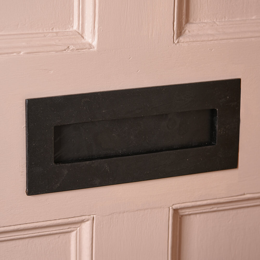 Black beeswax letterplate on pink door