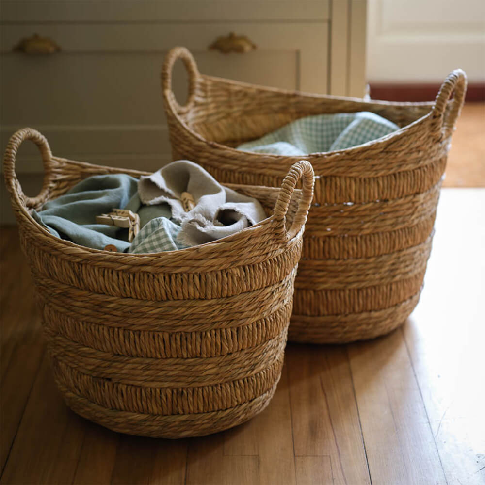 Boat Baskets on a wooden floor with laundry