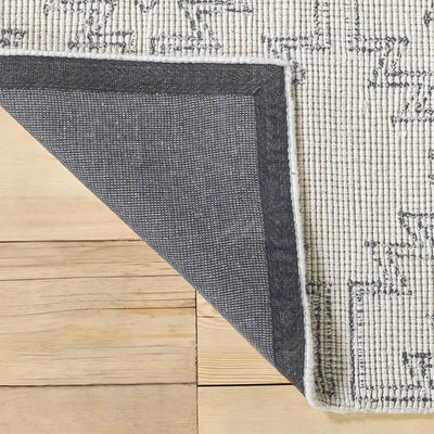 Black & White Bidiru Rug folded back to reveal the quality lining of the rug