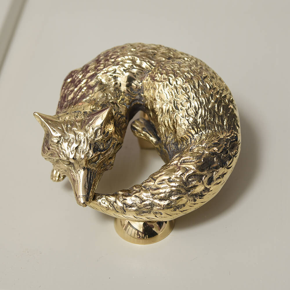 Brass fox door knocker with strike plate showing beautiful face and curled tail