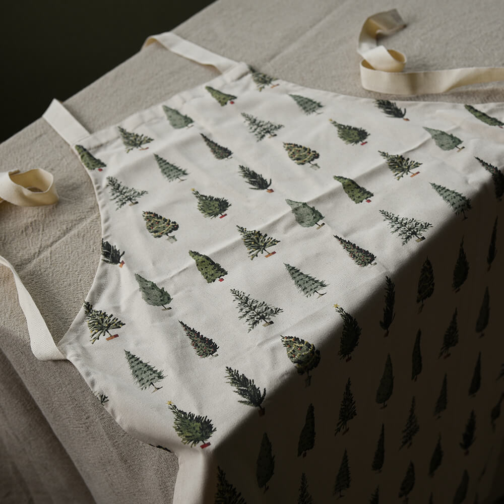 Apron with Christmas tree pattern on a neutral background