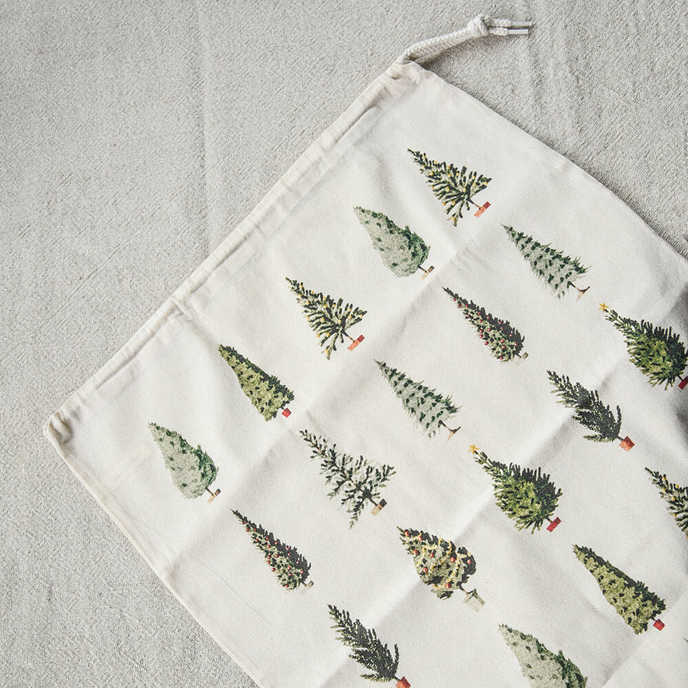 Fabric bag with Christmas tree pattern on a light grey background