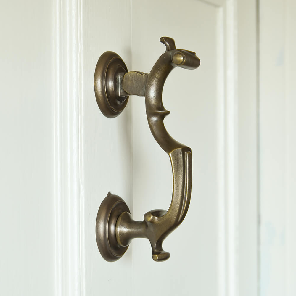 Distressed Antique Brass London Doctors Door Knocker on cream door