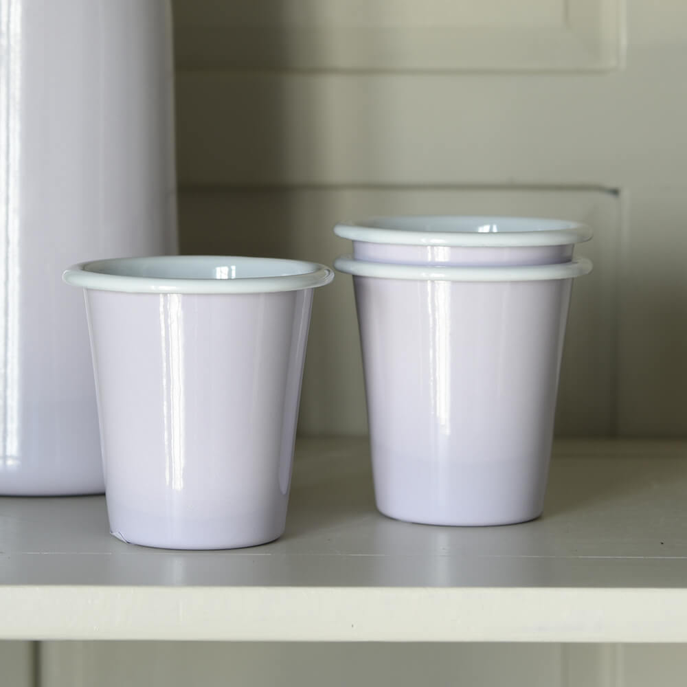 Pale purple cups on a shelf