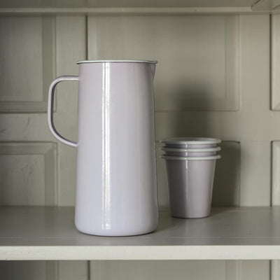 Pale purple jug and matching tumblers on a shelf