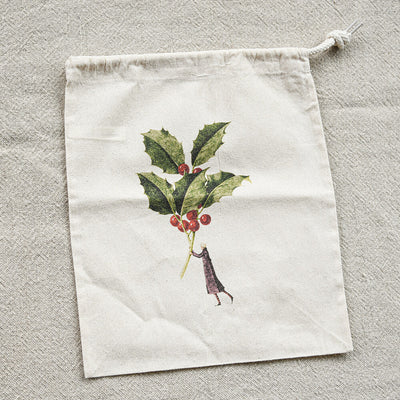 Drawstring bag with holly design on a textured surface