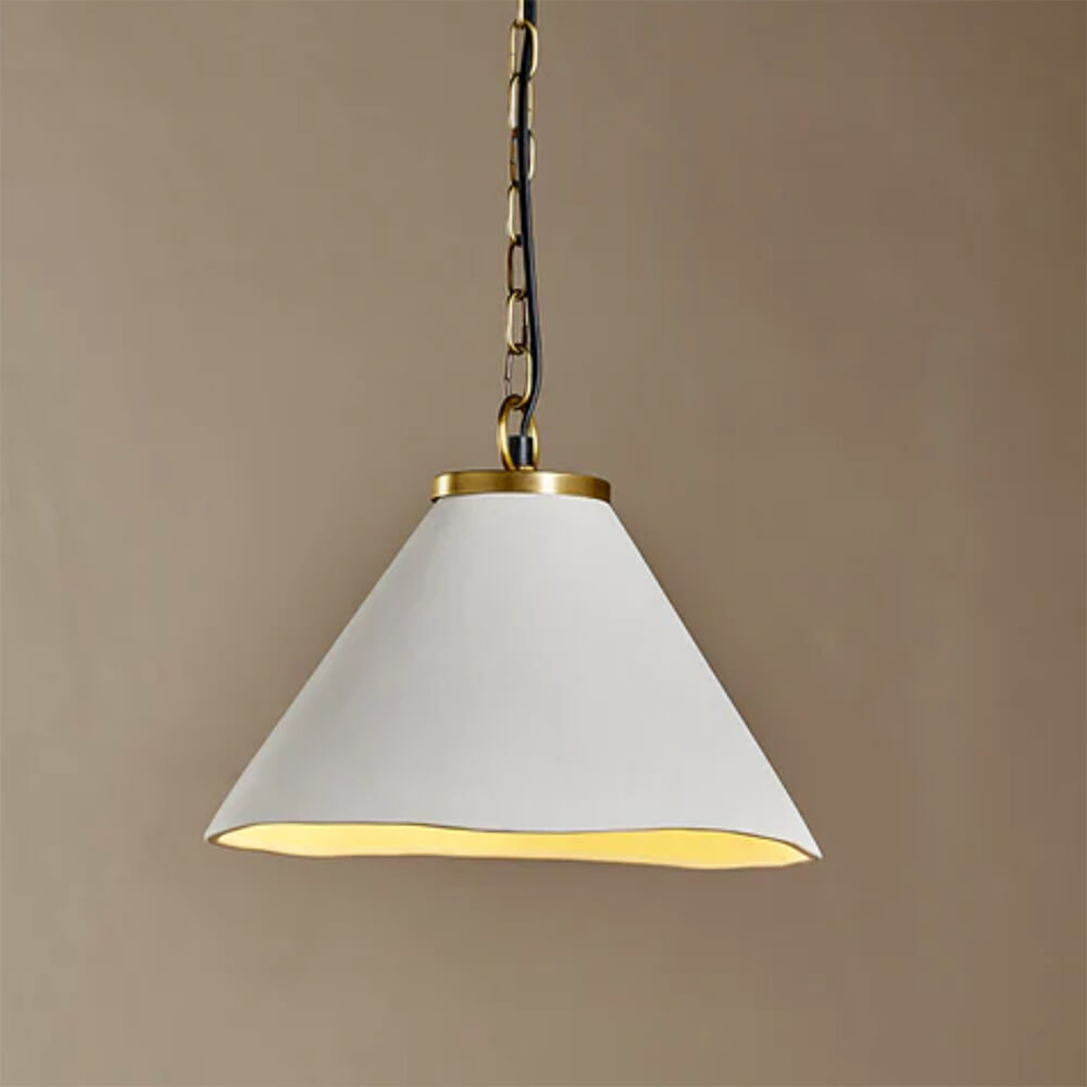 White ceramic pendant light with an organic cone shape and antique brass fittings against a taupe background