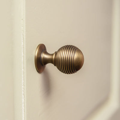 Light Antique Brass Reeded Beehive Cabinet Knob