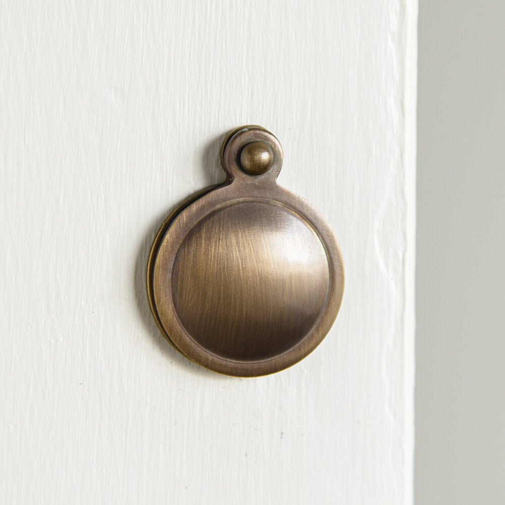 Light Antique Brass Covered Escutcheon on painted door