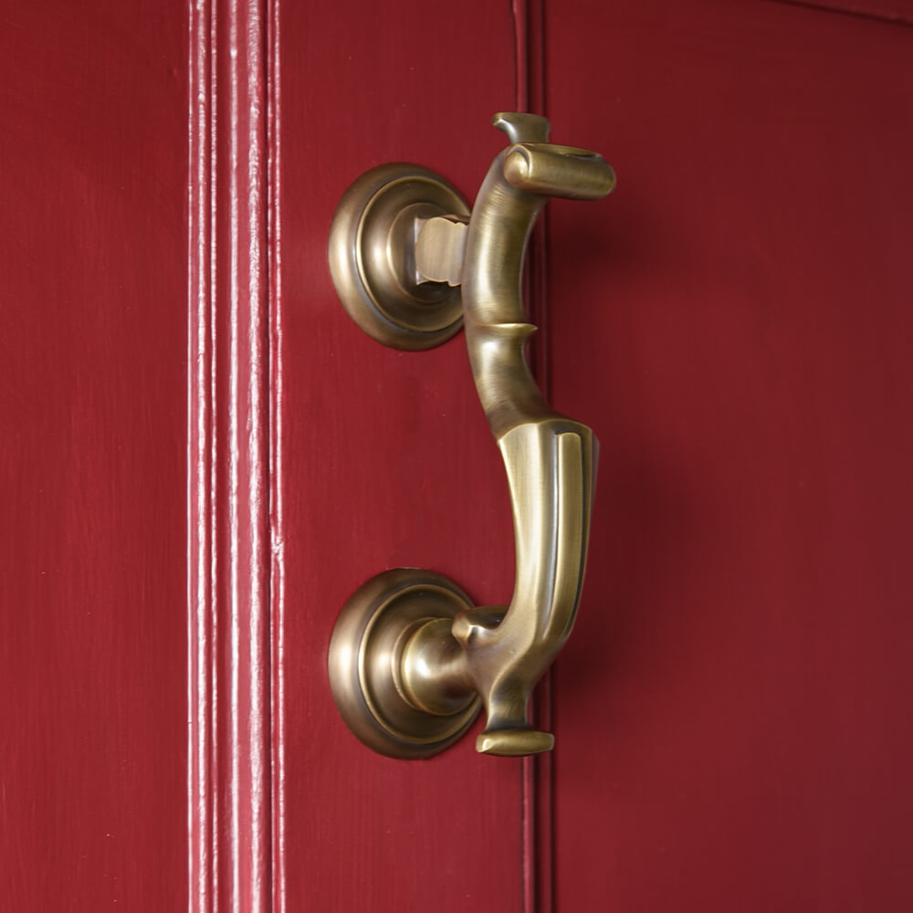 Light Antique Brass London Doctors Door knocker on red front door