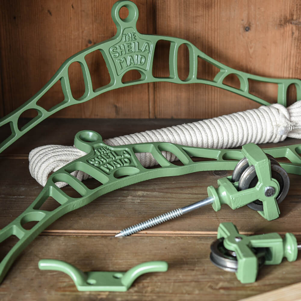 Parts of a sheila maid shown in sage green and including rope and iron fixings