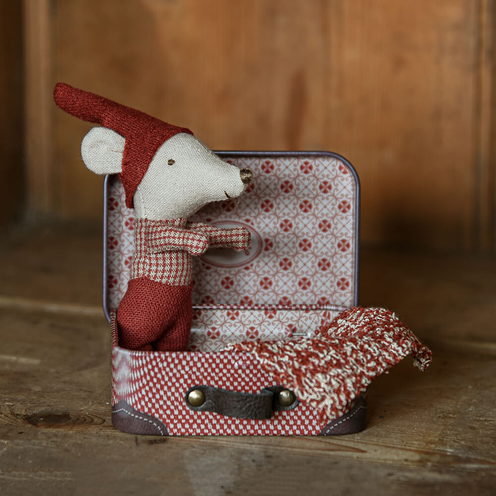 Mouse tiny toy in little metal suitcase