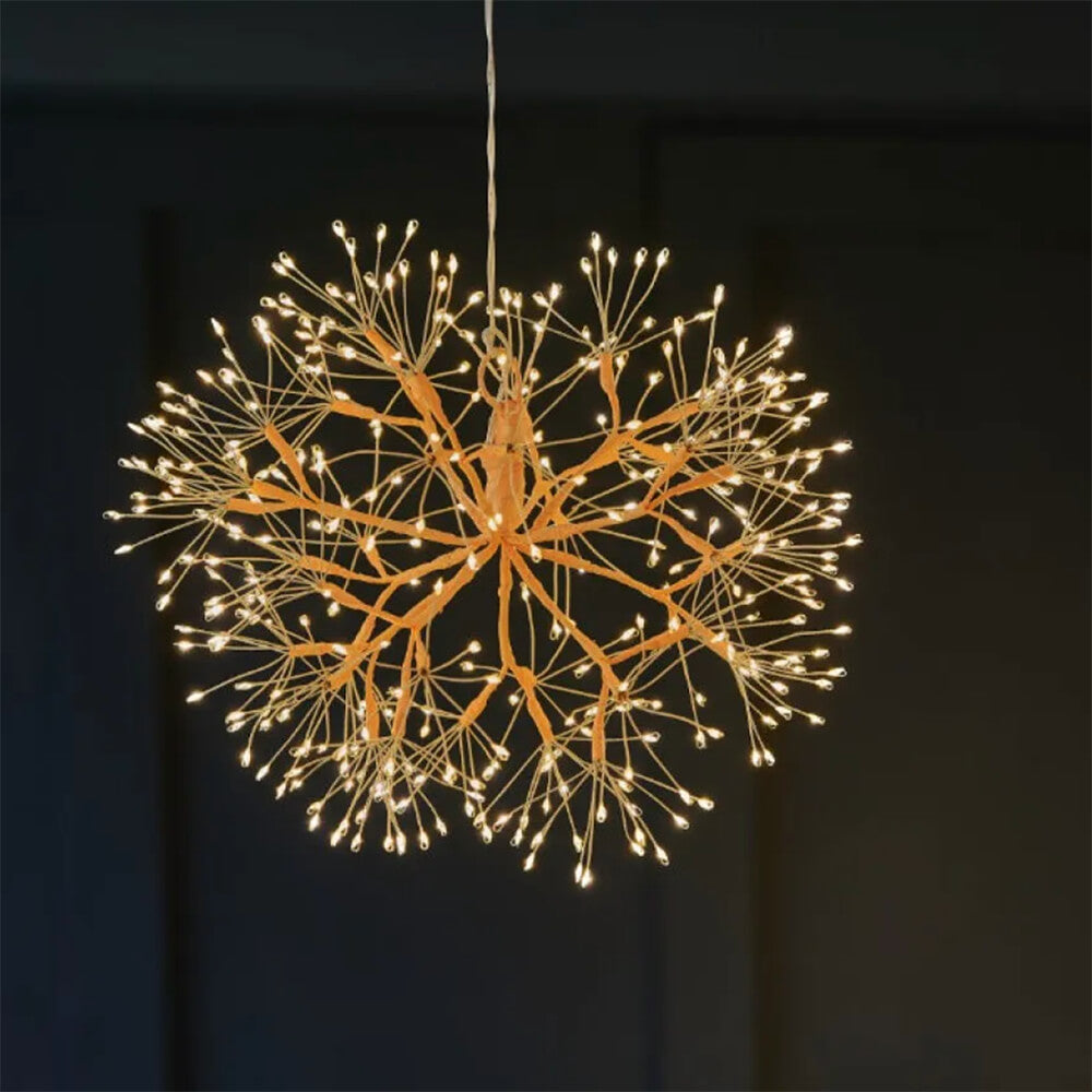 Decorative chandelier with multiple lights on a dark background