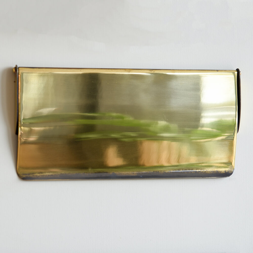 Gold rectangular letter tidy cover on a white background