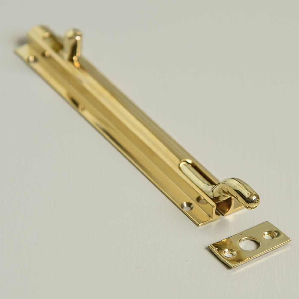 Brass slide bolt with a curved necked slide piece