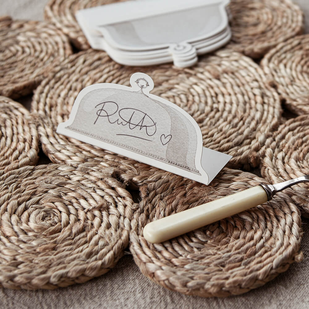 Placecard with knife on a textured woven surface