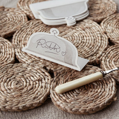 Placecard with knife on a textured woven surface